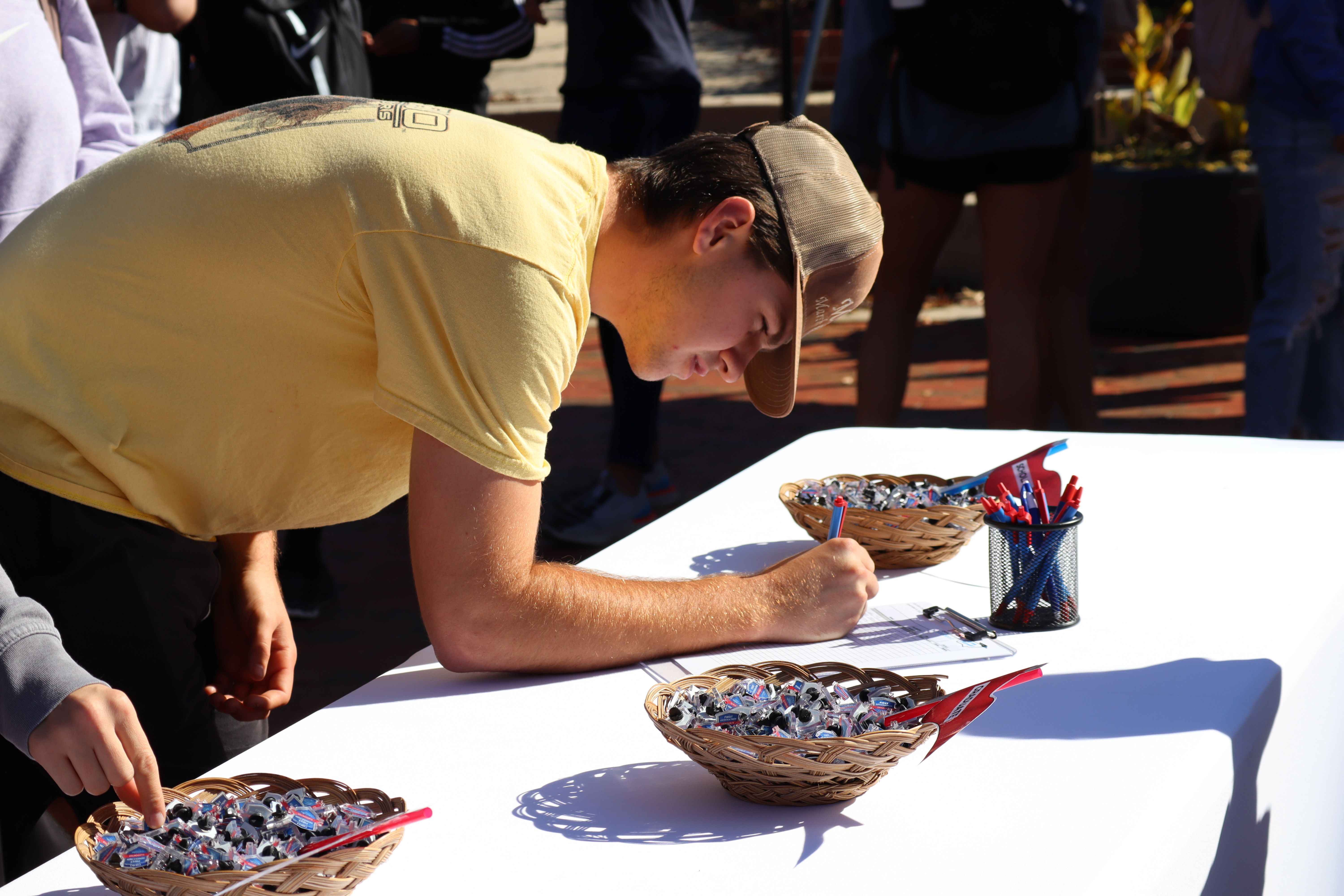 Catawba College student signing in for the first-gen event