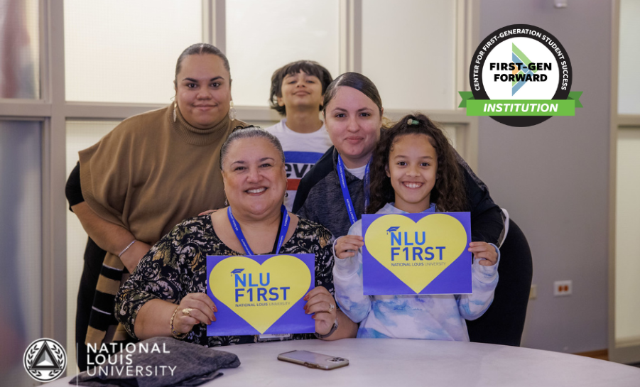 Group of first-generation families holding program signs at National Louis University