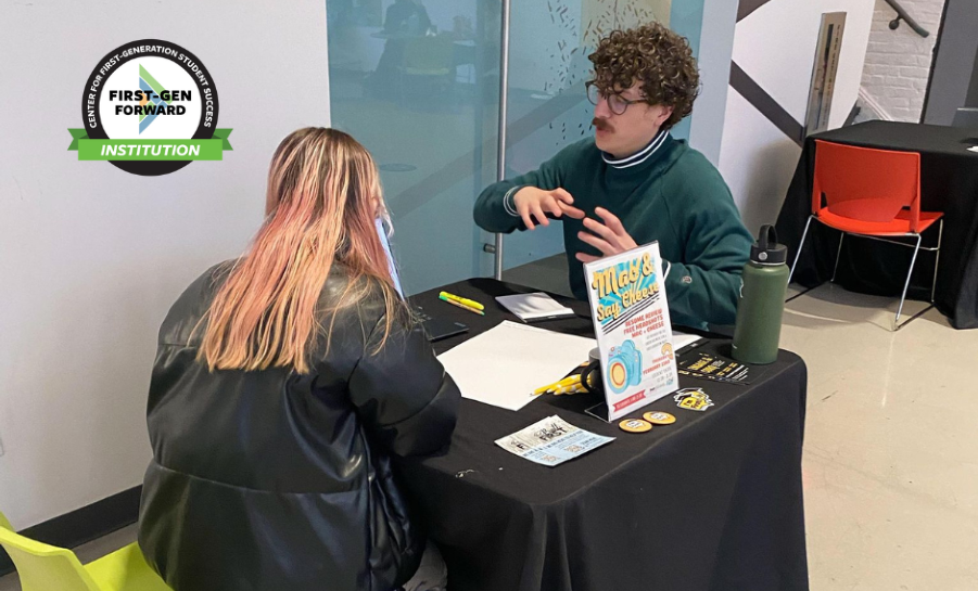 Two students working together at a table at Pratt Institute