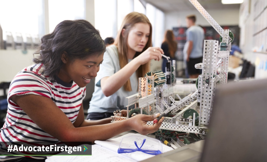 Two female students working on a robot in STEM lab