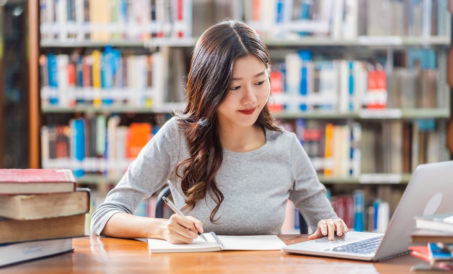 student studying in the library