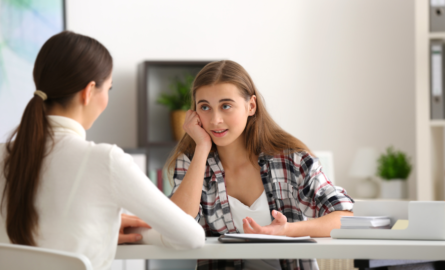 Female student talking to female counselor