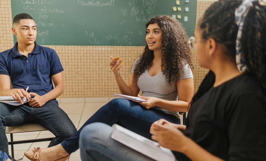 Group of Latin Students Talking in Classroom