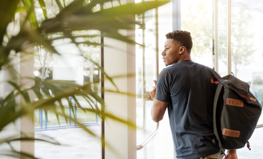 Student Walking through a Door