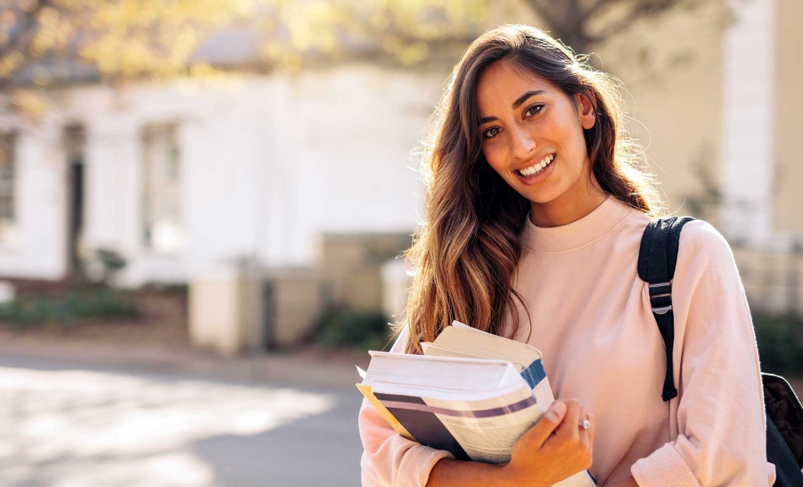 Student holding books