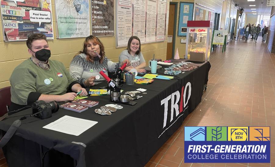 Three TRIO staff members tabling in hallway