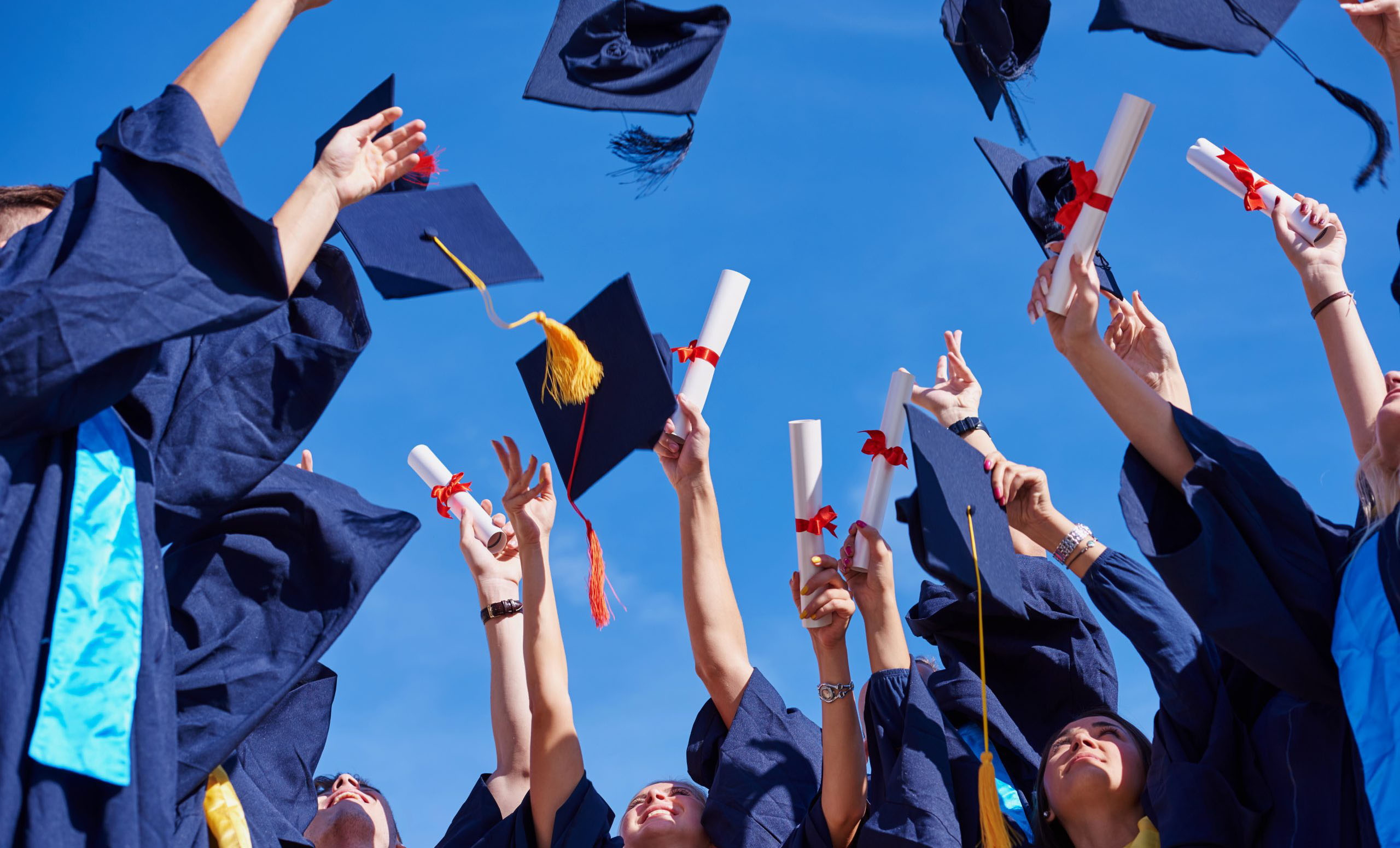 graduation caps and gowns