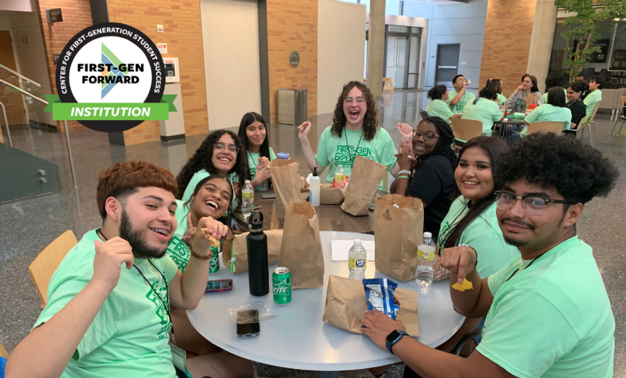 Group of students eating lunch at a round cafeteria table