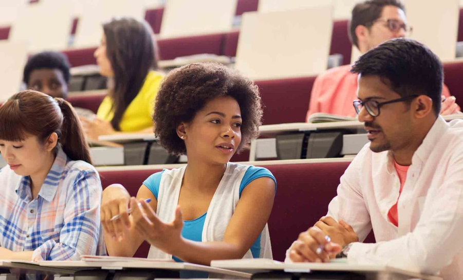 male and female students talking in calss