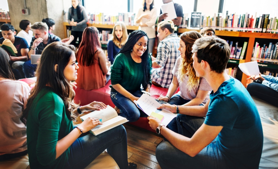 students talking in library