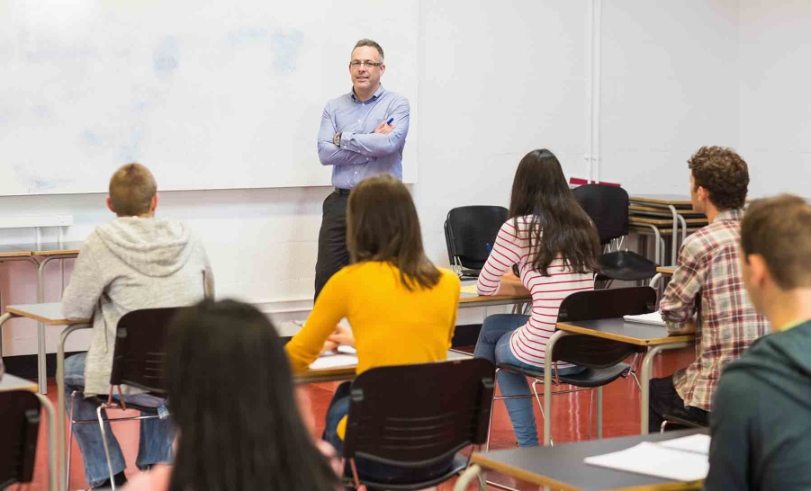 teacher facing a group of students