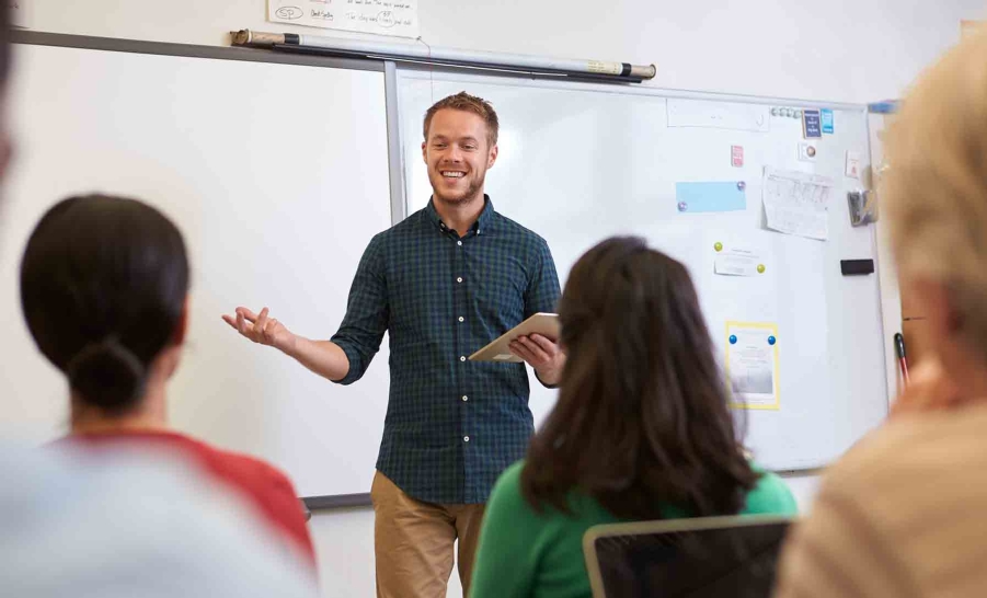 teacher smiling at students