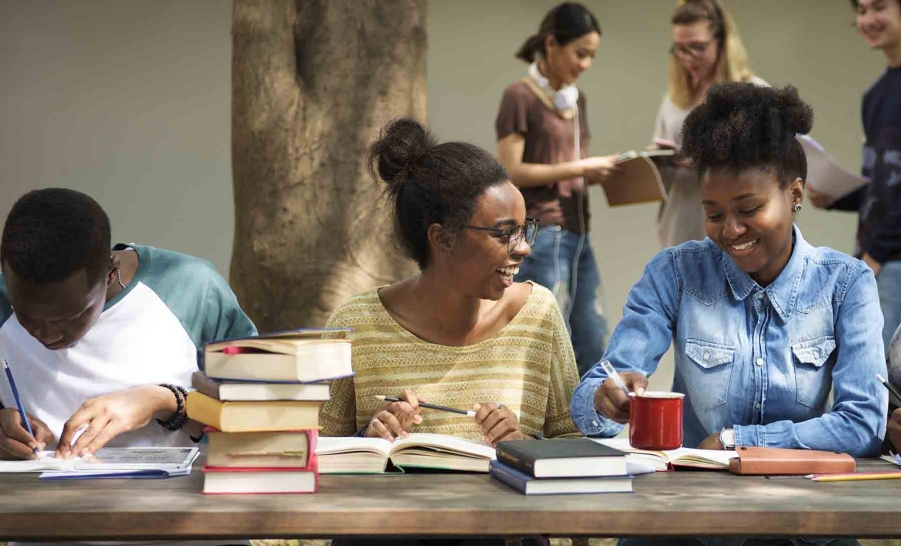 three friends studying outside