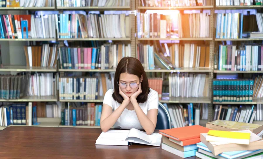 tired student in library