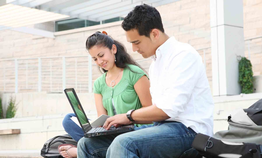 two latino students studying
